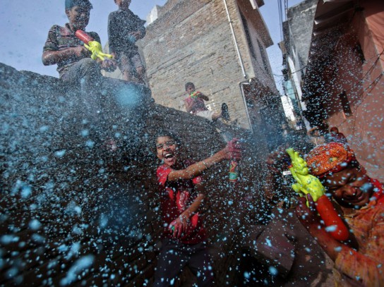 boys-spray-colored-foam-near-the-bankey-bihari-temple-in-vrindavan