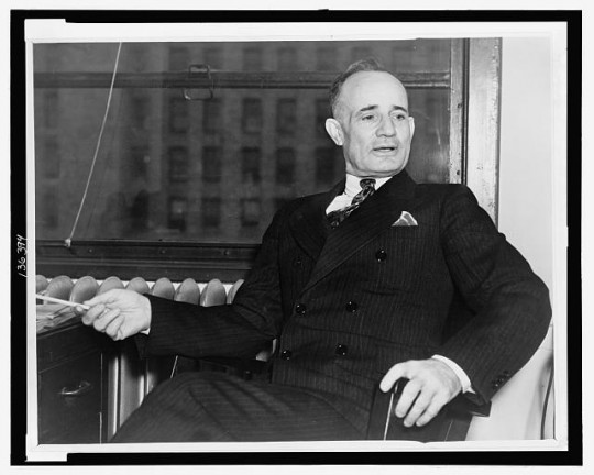Napoleon_Hill_seated_in_chair