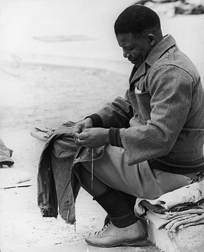 Nelson Mandela Sewing Prison Clothes, c. 1966.